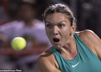 Caption

Hawk-eyed: Simona Halep of Romania watches the ball intently during her match against Venus Williams