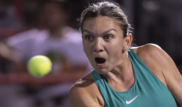 Caption

Hawk-eyed: Simona Halep of Romania watches the ball intently during her match against Venus Williams