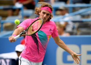 Stefanos Tsitsipas hits a backhand during his match against Alexander Zverev, Friday