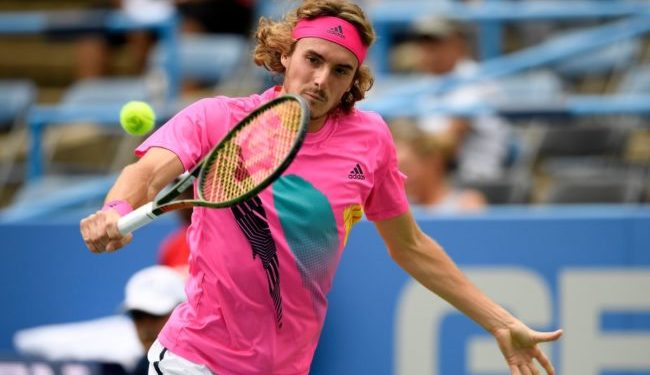 Stefanos Tsitsipas hits a backhand during his match against Alexander Zverev, Friday