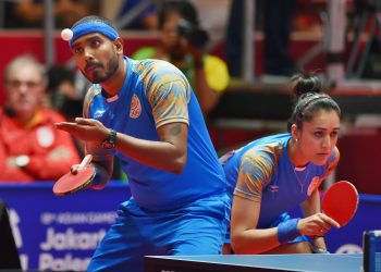 A Sharath and Manika Batra in action during the mixed-double table tennis match in Jakarta, Wednesday