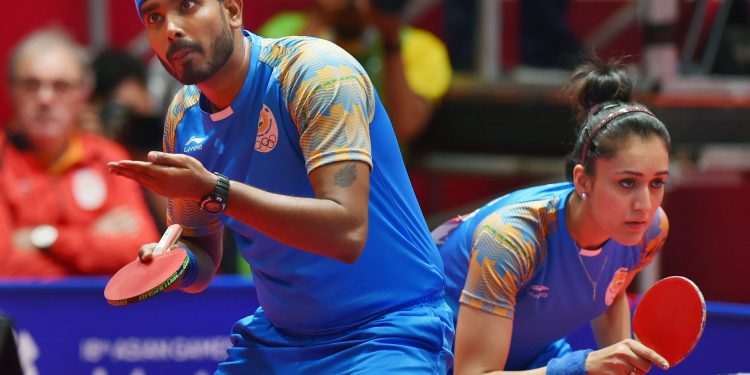 A Sharath and Manika Batra in action during the mixed-double table tennis match in Jakarta, Wednesday