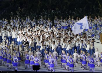 The combined Koreas march into Gelora Bung Karno Stadium under the 'unification' flag during the opening ceremony for the 18th Asian Games in Jakarta