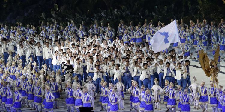 The combined Koreas march into Gelora Bung Karno Stadium under the 'unification' flag during the opening ceremony for the 18th Asian Games in Jakarta
