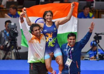 Vinesh Phogat is does a lap of 
honour on the shoulders of Indian team support staff after winning gold at the Jakarta Asiad, Monday