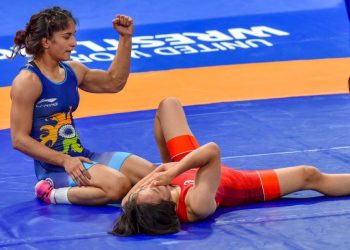 Vinesh Phogat pumps are fists in delight after winning her final against Yuki Irie at Jakarta, Monday