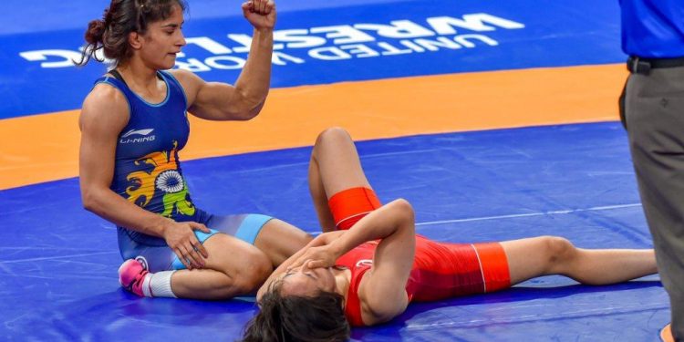 Vinesh Phogat pumps are fists in delight after winning her final against Yuki Irie at Jakarta, Monday