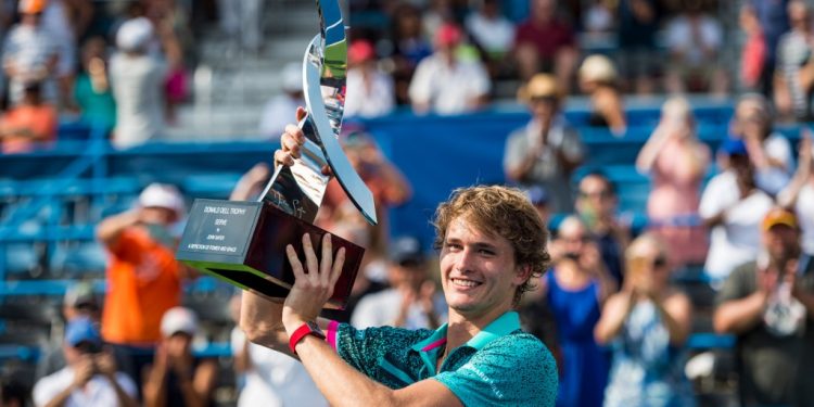 Alexander Zverev poses with the trophy after winning the singles crown at the Washington Open
