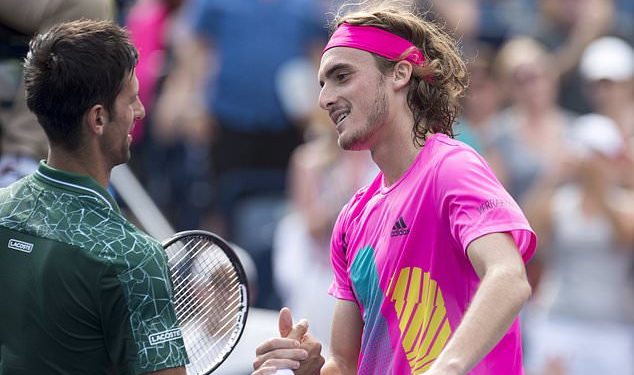 Novak Djokovic (L) congratulates Stefanos Tsitsipas after the latter’s stunning win, Thursday at Toronto 