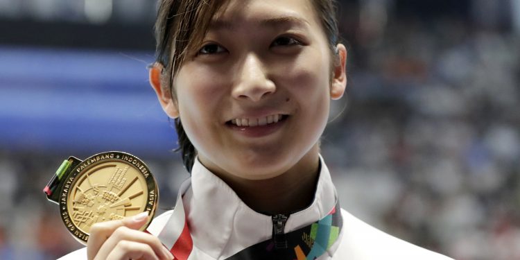 Japan's Rikako Ikee shows her 50m freestyle gold at the Asian Games