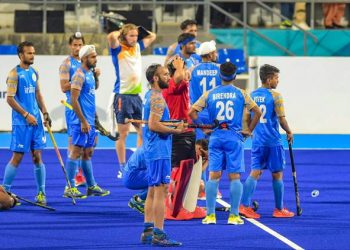 Indian hockey team look on after being defeated by Malaysian in the semifinal match of Asian Games