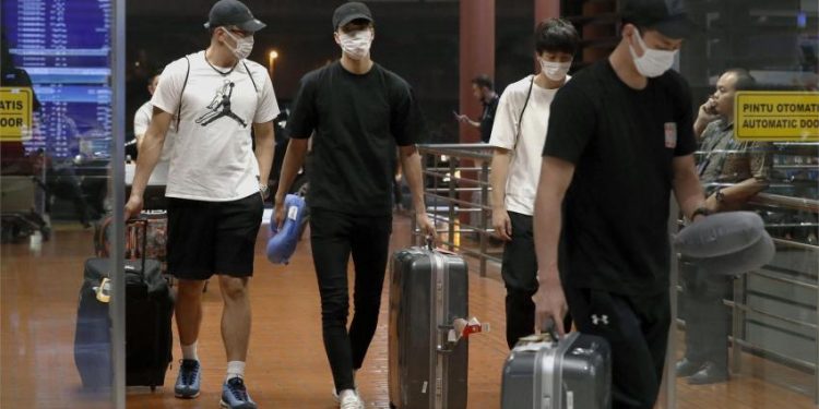 The four Japanese players at the Jakarta airport before their departure, Monday