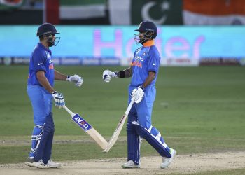 Rohit Sharma (L) and Shikhar Dhawan greet each other during their ODI against Pakistan in Dubai