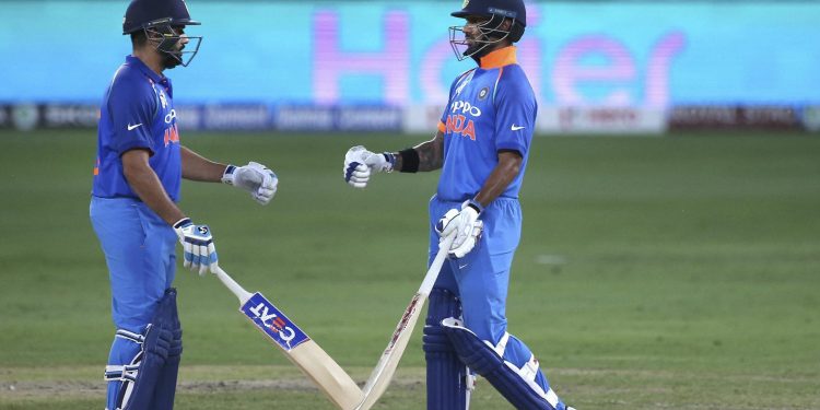 Rohit Sharma (L) and Shikhar Dhawan greet each other during their ODI against Pakistan in Dubai