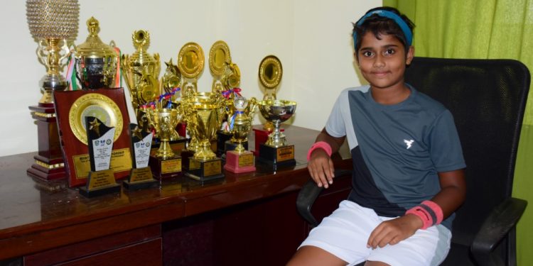 Sohini poses with the trophies she has won in the last 10 months