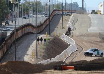 Three men from India jump the fence from Mexico and give themselves up to U.S. border patrol agents in Calexico, California, U.S. February 8, 2017. REUTERS/Mike Blake/Files