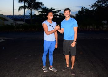 Purnima Hembram (L) and Amiya Kumar Mallick pose for a photograph during their training session at Kalinga Stadium in Bhubaneswar, Monday    