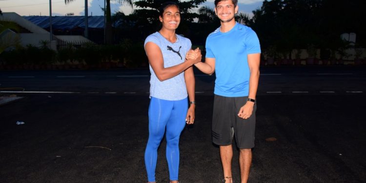 Purnima Hembram (L) and Amiya Kumar Mallick pose for a photograph during their training session at Kalinga Stadium in Bhubaneswar, Monday    