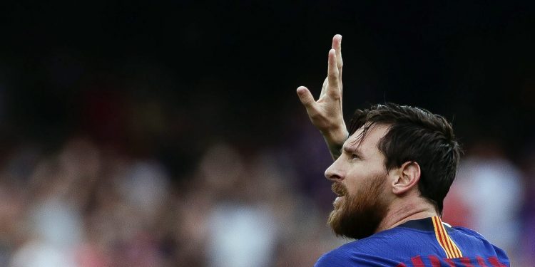 Barcelona's Lionel Messi celebrates scoring the opening goal against Huesca at the Camp Nou stadium