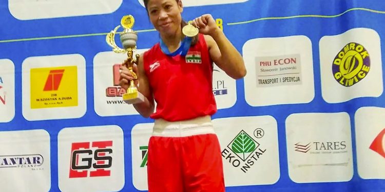 MC Mary Kom poses with her gold medal and trophy after emerging victorious in the 48kg late Saturday evening 