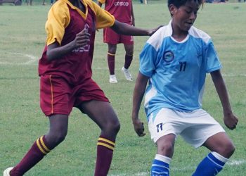 Anju Tamang (in blue) vies for the ball against West Bengal at Bidanasi Ground, Cuttack, Thursday