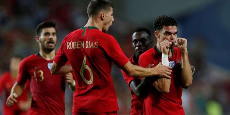 Pepe (R) celebrates with teammates after scoring against Croatia