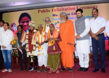 (From L) Priyadarshi Mishra, Dilip Tirkey, Achyuta Samanta, Saraswati Chand, Dutee Chand, Governor Ganeshi Lal, Chakradhara Chand, Akhuji Chand, Prasanna Patasani, Anubhav Mohanty, Ananta Narayan Jena and Vishal Dev pose for a group photo during the sprinter’s felicitation programme, Monday   