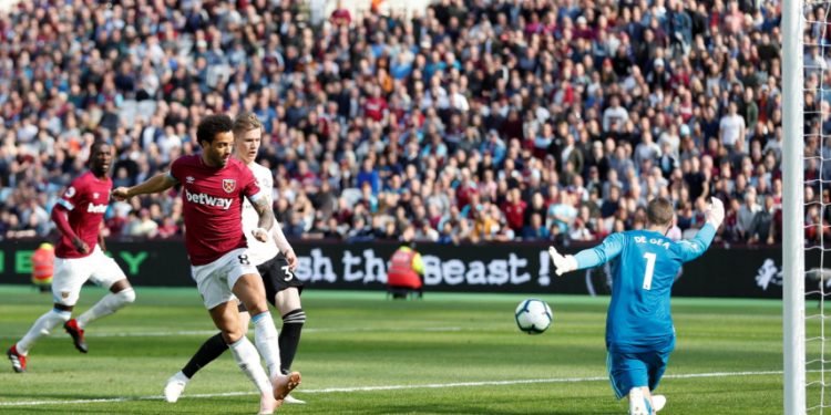 West Ham United’s Felipe Anderson scores his team’s first goal against Manchester United at London, Saturday