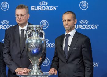 German Football Association president Reinhard Grindel (L) and UEFA president Aleksander Ceferin pose with the UEFA Euro trophy after Germany won the bid to host Euro 2024  