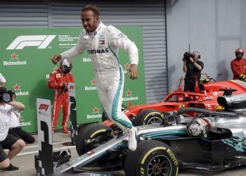 Mercedes driver Lewis Hamilton of Britain celebrates after winning the Formula One Italy Grand Prix at the Monza racetrack