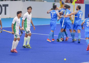 Akashdeep Singh celebrates with teammates after scoring their first goal against Pakistan during their bronze medal match at the Asian Games