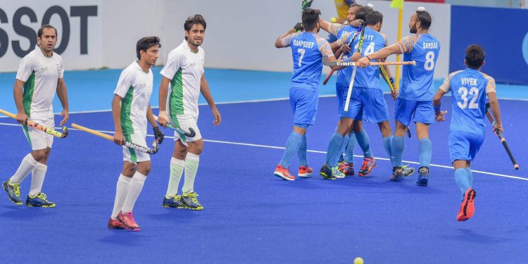 Akashdeep Singh celebrates with teammates after scoring their first goal against Pakistan during their bronze medal match at the Asian Games