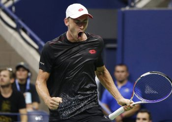 John Millman reacts after winning a point against Roger Federer during their fourth round match of the US Open