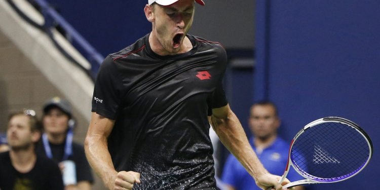 John Millman reacts after winning a point against Roger Federer during their fourth round match of the US Open