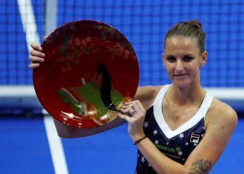 Karolina Pliskova holds the Pan Pacific Open winner's trophy after defeating Noami Osaka in final