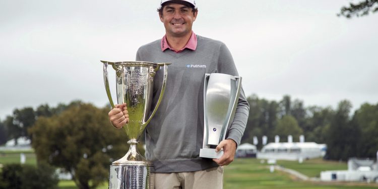 Keegan Bradley poses with the two trophies following the BMW Championship golf tournament at the Aronimink Golf Club