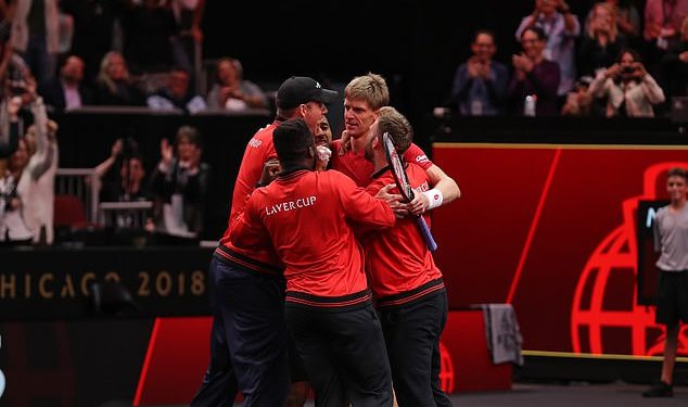Team World players hug Kevin Anderson (right) after his stunning win over Novak Djokovic at Chicago, Saturday 