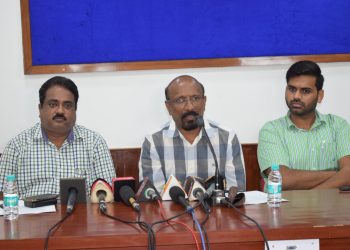 AFI general secretary CK Valson (C) along with state sports department officials Manoj Padhi (L) and Sumit Pandey address the media at the Kalinga Stadium conference hall, Tuesday           