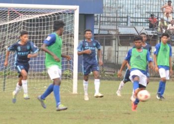 Sunshine Club and Azad Hind Club players vie for the ball during their match at Cuttack, Monday