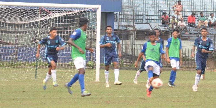 Sunshine Club and Azad Hind Club players vie for the ball during their match at Cuttack, Monday