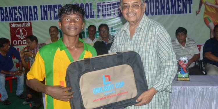 Sundar Mohan Kisko of Unit-I High School receives the man of the match award in Bhubaneswar, Thursday