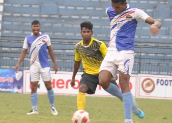 Azad Hind Club and Chand Club players fight for the ball in Cuttack, Wednesday     
