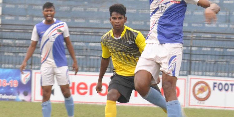 Azad Hind Club and Chand Club players fight for the ball in Cuttack, Wednesday     