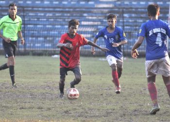 Rising Student Club and Jay Durga Club players vie for the ball during their match at Barabati Stadium in Cuttack, Sunday                        