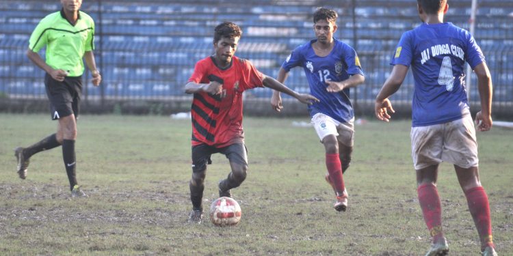 Rising Student Club and Jay Durga Club players vie for the ball during their match at Barabati Stadium in Cuttack, Sunday                        