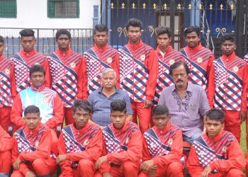 Footballers of the Odisha sub-junior team selected for the nationals at Patna pose with officials at the Barabati Stadium in Cuttack, Saturday                              