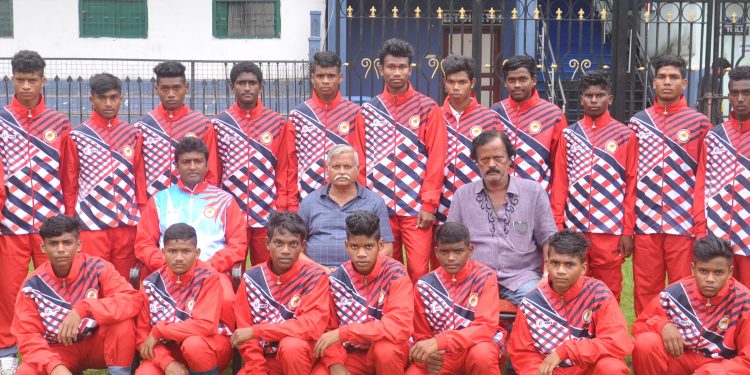 Footballers of the Odisha sub-junior team selected for the nationals at Patna pose with officials at the Barabati Stadium in Cuttack, Saturday                              