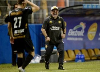 Diego Maradona celebrates after his side’s third goal, Monday