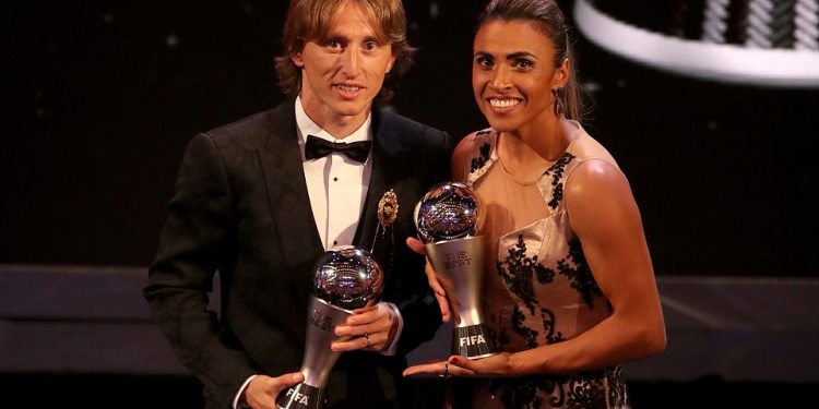 Luka Modric and Marta are all smiles as they pose with their FIFA best player trophies at London, Monday evening