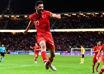 Emre Akbaba celebrates one of his two goals after scoring against Sweden